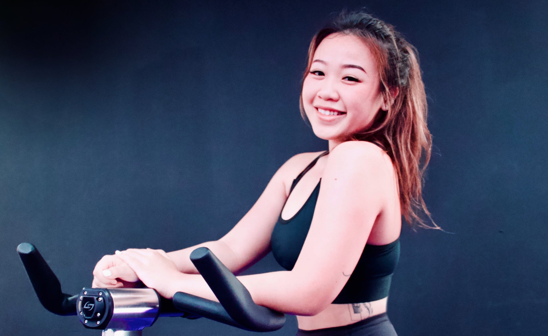 Starting her day right with Spinning: Indoor Rhythmic Cycling Instructor Natalie Teo